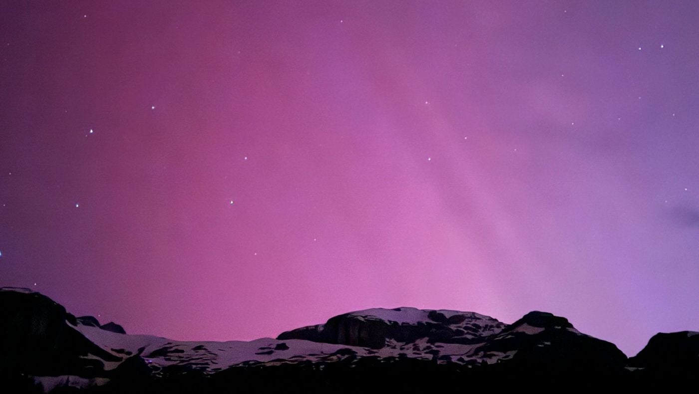 Enchantment of pink light: Northern lights in the Dolomites